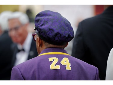 Spike Lee, wearing a coat with the number 24 in memory of NBA player Kobe Bryant, poses on the red carpet during the Oscars arrivals at the 92nd Academy Awards in Hollywood, Los Angeles, Calif., Feb. 9, 2020.