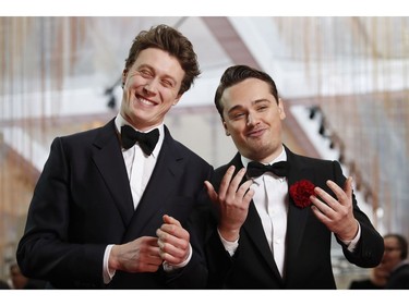 George MacKay and Dean-Charles Chapman react on the red carpet at the 92nd Annual Academy Awards on Feb. 9, 2020 in Hollywood, Calif.