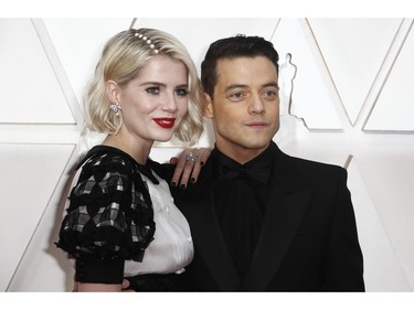 Rami Malek and Lucy Boynton pose on the red carpet at the 92nd Annual Academy Awards on Feb. 9, 2020 in Hollywood, Calif.