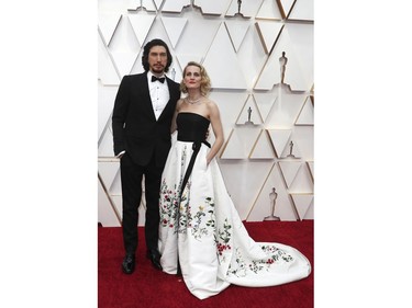 Adam Driver and his wife Joanne Tucker pose embrace on the red carpet at the 92nd Annual Academy Awards on Feb. 9, 2020 in Hollywood, Calif.