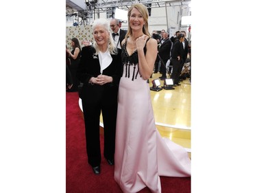 Laura Dern, right, and her mother Diane Ladd pose embrace on the red carpet at the 92nd Annual Academy Awards on Feb. 9, 2020 in Hollywood, Calif.