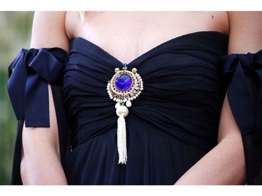 A detail of Margot Robbie's dress is shown as she poses on the red carpet during the Oscars arrivals at the 92nd Academy Awards in Hollywood, Calif., Feb. 9, 2020.