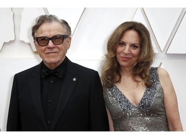 Harvey Keitel and Daphna Kastner pose on the red carpet at the 92nd Annual Academy Awards on Feb. 9, 2020 in Hollywood, Calif.
