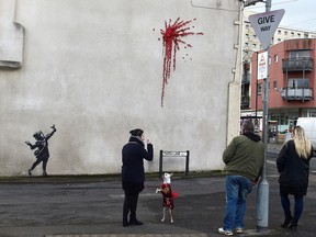 A suspected new mural by artist Banksy is pictured in Marsh Lane in Bristol, Britain, February 13, 2020. (REUTERS/Rebecca Naden)