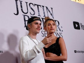 Justin Bieber and his wife Hailey Baldwin pose at the premiere for the documentary television series "Justin Bieber: Seasons" in Los Angeles, Jan. 27, 2020.