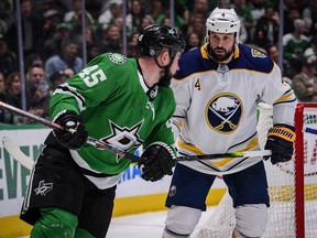 Dallas Stars defenceman Roman Polak (45) and Buffalo Sabres defenceman Zach Bogosian (4) eye each other at the American Airlines Center in Dallas. (Jerome Miron-USA TODAY Sports)