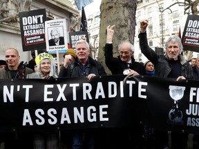 Former Greek Finance minister Yanis Varoufakis, fashion designer Vivienne Westwood, editor in chief of WikiLeaks Kristinn Hrafnsonn, Assanger's Father John Shipton and singer Roger Waters attend a protest against the extradition of Julian Assange outside the Australian High Commission in London, Britain February 22, 2020.