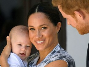 Britain's Prince Harry and his wife Meghan, Duchess of Sussex holding their son Archie, meet Archbishop Desmond Tutu (not pictured) at the Desmond & Leah Tutu Legacy Foundation in Cape Town, South Africa, September 25, 2019.