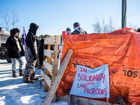 First Nations members of the Tyendinaga Mohawk Territory block train tracks servicing Via Rail, as part of a protest against British Columbia's Coastal GasLink pipeline, in Belleville, Ont., Feb. 8, 2020.   REUTERS/Alex Filipe