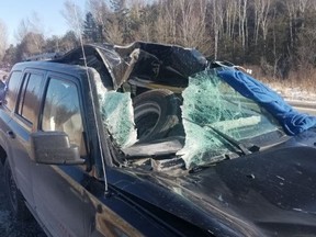 An image released by OPP of a Jeep damaged by a tire that came off a tractor trailer on Wednesday, Feb. 19, 2020. (OPP_CR/Twitter)