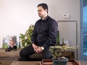 Hassan Shadkhoo sits in his Toronto apartment next to a photo of his wife, Sheyda, on Tuesday February 4, 2020.