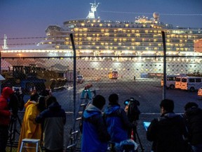 A bus arrives near the cruise ship Diamond Princess, where dozens of passengers were tested positive for coronavirus, at Daikoku Pier Cruise Terminal in Yokohama, south of Tokyo, Japan, February 16, 2020.