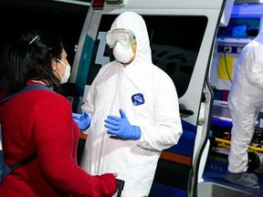 Salvadoran citizen is being examined at the Salvador International Airport before moving to quarantine upon arrival from China due the global coronavirus situation, in San Salvador, El Salvador, February 3, 2020.