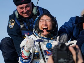 NASA astronaut Christina Koch reacts shortly after landing in a remote area outside the town of Dzhezkazgan, Kazakhstan, on February 6, 2020. (SERGEI ILNITSKY/POOL/AFP via Getty Images)