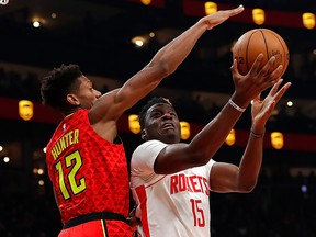 Clint Capela of the Houston Rockets draws a foul as he drives against De'Andre Hunter of the Atlanta Hawks at State Farm Arena on January 8, 2020 in Atlanta. (Kevin C. Cox/Getty Images)