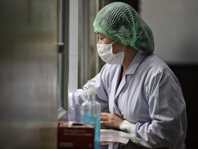 A lab technician registers samples from potential victims of the novel coronavirus at the Centre for Emerging Infectious Diseases of Thailand at Chulalongkorn University in Bangkok on Wednesday, Feb. 5, 2020.