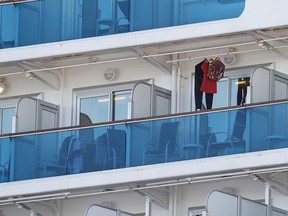 Clothes hanging at a cabin's balcony are seen after the cruise ship Diamond Princess, where 10 more passengers tested positive for coronavirus, docked at Daikoku Pier Cruise Terminal in Yokohama, south of Tokyo, Japan, Feb. 6, 2020.