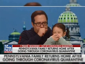 During an interview with Fox News, Frank Wucinski kept coughing while with his daughter Annabel. The family had just returned from China and was quarantined. (YouTube screengrab)