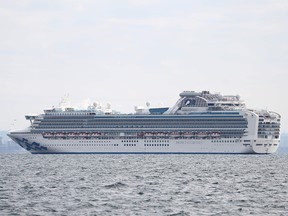 The Diamond Princess cruise ship with more than 3,700 people sits anchored in quarantine off the port of Yokohama on Feb. 4, 2020, a day after it arrived with passengers feeling ill.