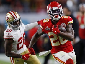 Damien Williams of the Kansas City Chiefs runs past Jimmie Ward of the San Francisco 49ers during Super Bowl LIV at Hard Rock Stadium on February 2, 2020 in Miami. (Kevin C. Cox/Getty Images)
