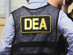This June 13, 2016 file photo shows Drug Enforcement Administration (DEA) agents in Florida. (Joe Burbank/Orlando Sentinel via AP, File)