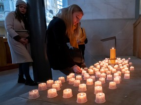 People light candles in memory of the victims of the bombing at the end of WW2 in Dresden, Germany, February 13, 2020. (REUTERS/Matthias Rietschel)