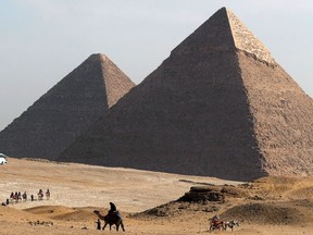 Tourists visit the area of the Great Pyramids in Giza, on the outskirts of Cairo, Egypt, February 22, 2020.