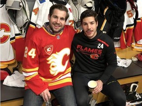 Jesse Hamonic, left, and his brother Travis smile for a photo during the Calgary FlamesÕ annual Fathers/Mentors Trip in 2019. Travis is a defenceman for the Flames, and Jesse among his biggest supporters.
