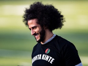 Colin Kaepernick looks on during his NFL workout held at Charles R Drew high school on November 16, 2019 in Riverdale, Georgia.