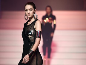 US model Gigi Hadid presents a creation by Jean Paul Gaultier during the Women's Spring-Summer 2020 Haute Couture collection fashion show in Paris, on January 22, 2020.