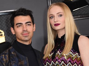 Actress Sophie Turner and her husband singer Joe Jonas arrive at the 62nd Annual Grammy Awards on Jan. 26, 2020, in Los Angeles. (VALERIE MACON/AFP via Getty Images)