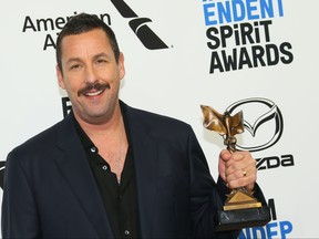 Winner of Best Male Lead for "Uncut Gems" actor Adam Sandler poses in the press room during the 35th Film Independent Spirit Awards in Santa Monica, Calif., on Feb. 8, 2020. (JEAN-BAPTISTE LACROIX/AFP via Getty Images)
