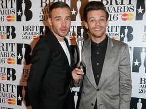 Liam Payne, left, and Louis Tomlinson from One Direction with their British Artist Video of the Year award at the BRIT Awards 2016 at The O2 Arena on Feb. 24, 2016 in London.  (Luca Teuchmann/Getty Images)