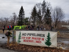 A group called Rising Tide Toronto announced on Twitter that its demonstrators had set up a rail blockade near Jane St. and Dundas St. West. Tuesday afternoon. (Rising Tide Toronto/Twitter)