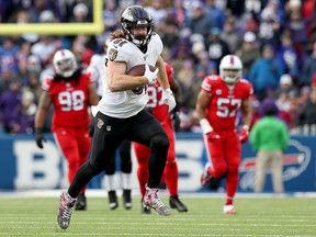Hayden Hurst of the Baltimore Ravens scores a touchdown during the third quarter of an NFL game against the Buffalo Bills at New Era Field on December 8, 2019 in Orchard Park, New York. (Bryan M. Bennett/Getty Images)