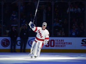 Carolina Hurricanes emergency goaltender David Ayres skates a lap after being named the game's first star after they beat the Toronto Maple Leafs 6-3 in NHL hockey action in Toronto, Saturday, Feb. 22, 2020.