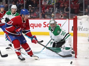 Canadiens' Nick Cousins plays the puck against Dallas Stars goaltender Ben Bishop at the Bell Centre on Saturday, Feb. 15, 2020, in Montreal.