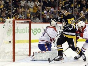 Pittsburgh Penguins left wing Jason Zucker (16) scores his second goal of the period against Montreal Canadiens goaltender Carey Price (31) during the second period at PPG PAINTS Arena on Feb. 14, 2020.