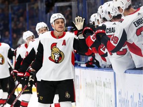Senators defenceman Mark Borowiecki celebrates with teammates at the bench after scoring a goal against the Lightning in Tampa on Dec. 17, 2019.