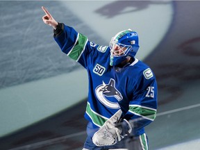 Feb 12, 2020; Vancouver, British Columbia, CAN; Vancouver Canucks goalie Jacob Markstrom (25) celebrates after being named first star the Vancouver victory over the Chicago Blackhawks at Rogers Arena. Vancouver won 3 -0. Mandatory Credit: Bob Frid-USA TODAY Sports