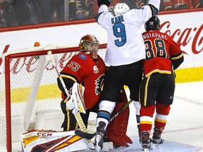 Calgary Flames goalie David Rittich is scored on by San Jose Sharks, Evander Kane in second period action of at the Scotiabank Saddledome in Calgary on Tuesday, Feb. 4, 2020.