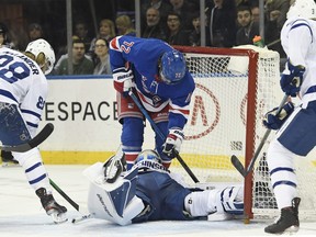 Rangers centre Filip Chytil slides into the net as Toronto Maple Leafs goaltender Michael Hutchinson makes a save during the second period at Madison Square Garden on Wednesday night.