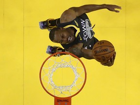 In this June 13, 2019, Andre Iguodala of the Golden State Warriors attempts a shot against the Toronto Raptors during Game 6 of the 2019 NBA Finals at Oracle Arena on  in Oakland, Calif.