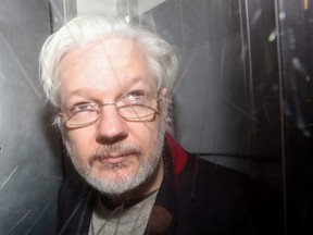 WikiLeaks' founder Julian Assange leaves Westminster Magistrates Court in London, England, on Jan. 13, 2020.