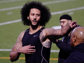 Colin Kaepernick points at someone in response to a comment at a special training event at Charles. R. Drew High School in Riverdale, Georgia, November 16, 2019. (REUTERS/Elijah Nouvelage)