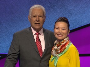Kristyna Ng, a corporate strategist with the City of Calgary, and Jeopardy! host Alex Trebek, ahead of her Feb. 11, 2020, appearance on the game show. Supplied photo. Credit: Jeopardy Productions, Inc.