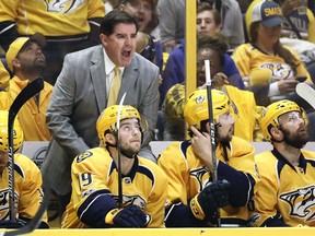 Nashville Predators head coach Peter Laviolette argues a call against the St. Louis Blues, Sunday, April 30, 2017, in Nashville, Tenn. (AP Photo/Mark Humphrey)