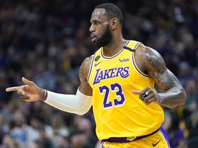 LeBron James of the Los Angeles Lakers reacts after his team scored against the Sacramento Kings during the first half of an NBA basketball game at Golden 1 Center on Feb. 1, 2020 in Sacramento, Calif.