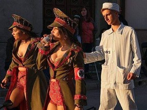 Women wearing bustiers and Nazi uniforms were part of a bizarre parade in Spain. (Video screen grab)
