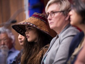 Environmental activist Ta'Kaiya Blaney, left, and Mary Ellen Turpel-Lafond, Director of UBC's Residential School History and Dialogue Centre, listen during a news conference to address the response from the chair of the RCMP's Civilian Review and Complaints Commission regarding the RCMP exclusion zone in the Wet'suwet'en territory, in Vancouver, on Thursday, February 20, 2020.